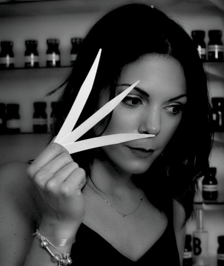 Marion Nadjar, perfumer, smelling perfume blotters